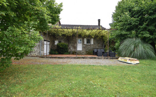 This charming one-story stone house